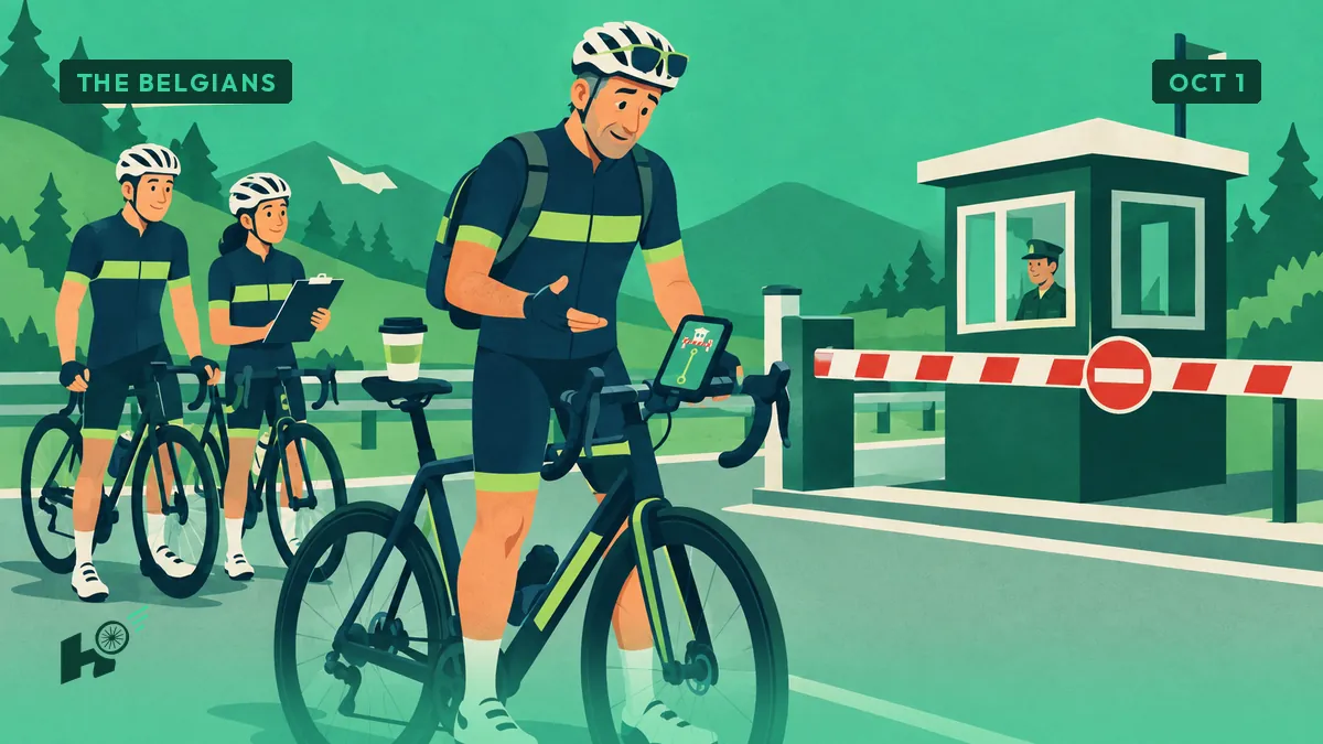 Xavier, wearing a backpack, looks at his bike computer where a route line stops dead at a border barrier with two cyclists waiting.